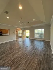 a view of a field with an trees