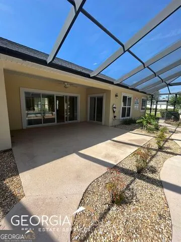 a large kitchen with stainless steel appliances granite countertop a stove a sink and a microwave