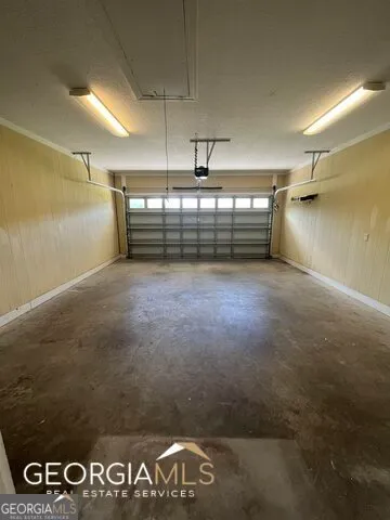 a kitchen with stainless steel appliances a stove a sink a microwave a counter top space and cabinets