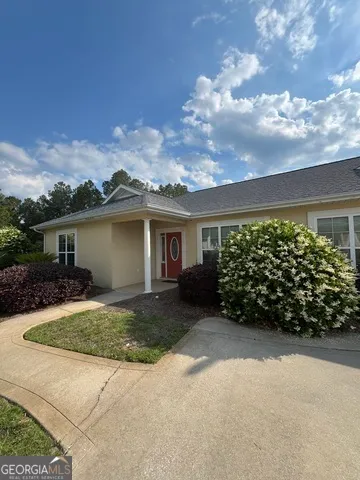 a view of hallway with wooden floor