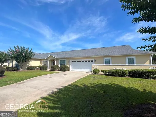 a view of an empty room and a window