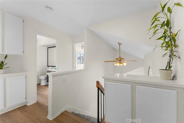 a view of kitchen with cabinets and wooden floor