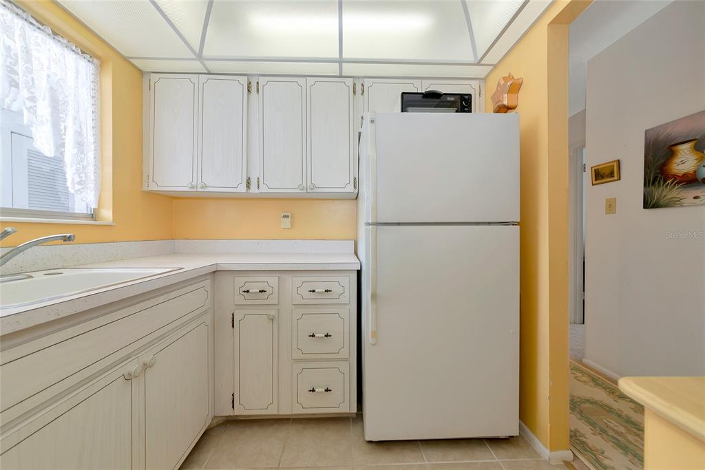 5912 Palm Lane, Unit C36 Bradenton, FL 34207 - Photo 13 of 34 a white refrigerator freezer sitting in a kitchen