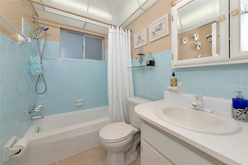 5912 Palm Lane, Unit C36 Bradenton, FL 34207 - Photo 17 of 34 a bathroom with a sink a toilet and shower