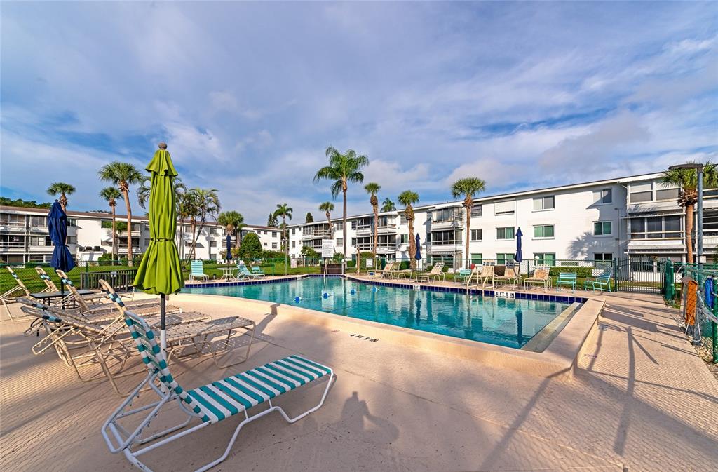 5912 Palm Lane, Unit C36 Bradenton, FL 34207 - Photo 25 of 34 a view of a swimming pool and outdoor seating