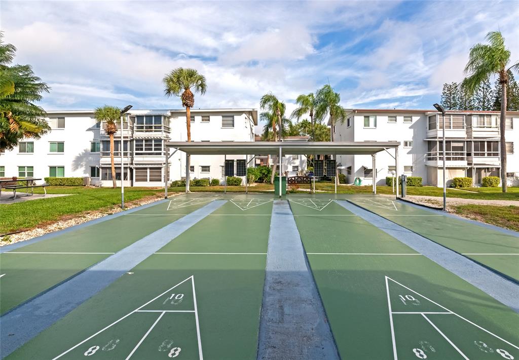 5912 Palm Lane, Unit C36 Bradenton, FL 34207 - Photo 31 of 34 a view of a swimming pool and a patio