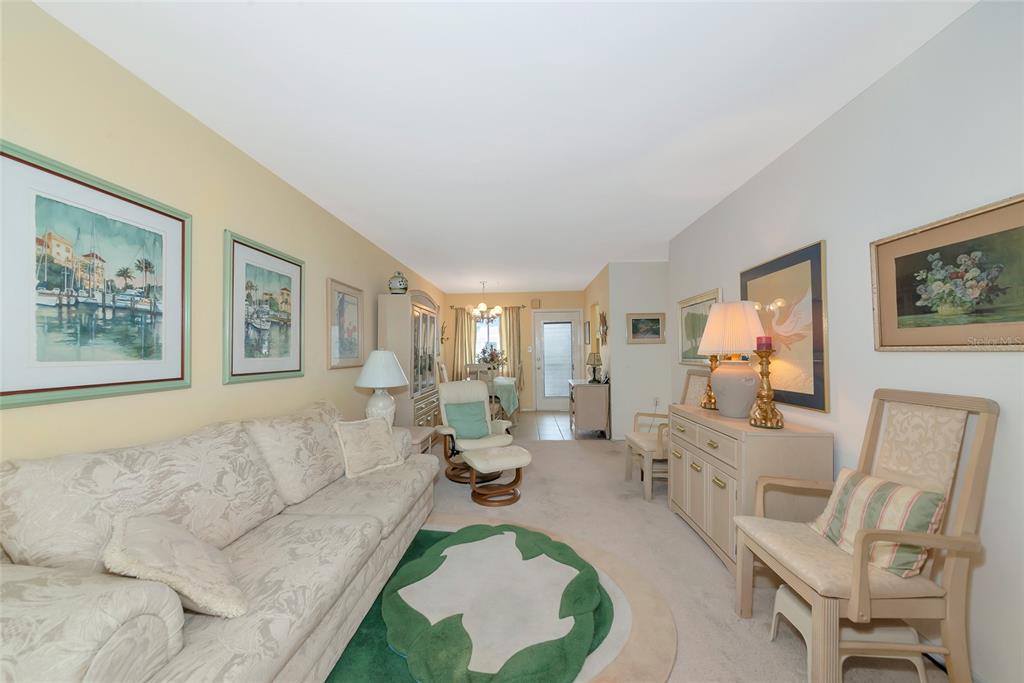 5912 Palm Lane, Unit C36 Bradenton, FL 34207 - Photo 8 of 34 a living room with furniture and a flat screen tv