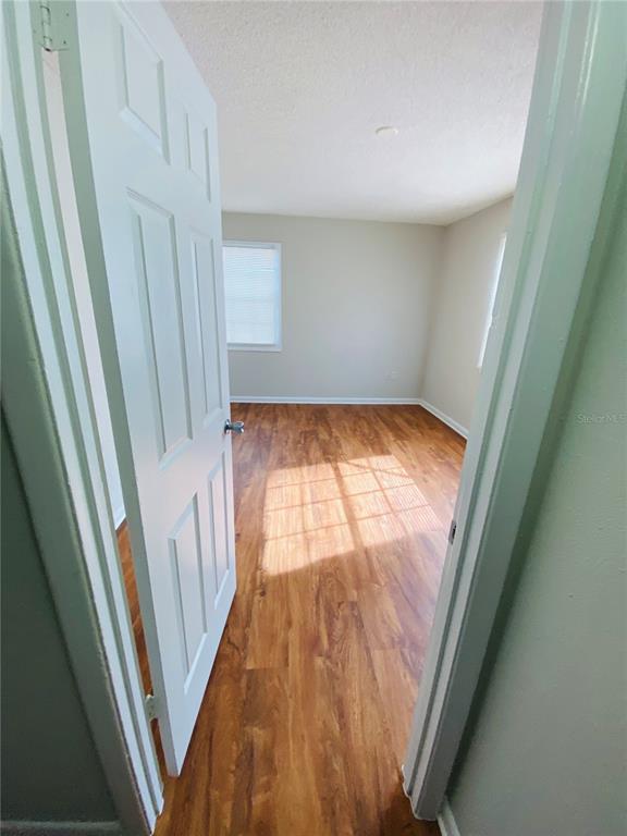 2757 L B McLeod Road, Unit C Orlando, FL 32805 - Photo 15 of 23 a view of an empty room and wooden floor