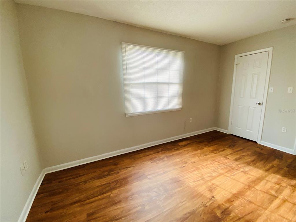 2757 L B McLeod Road, Unit C Orlando, FL 32805 - Photo 17 of 23 an empty room with a window