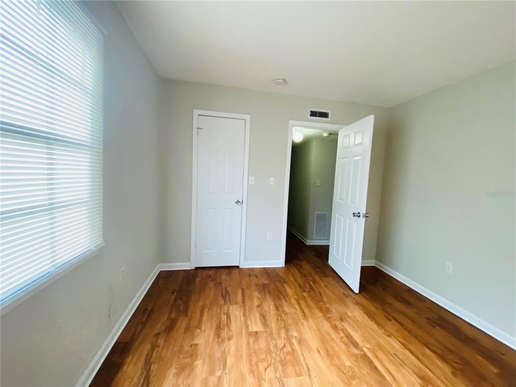 2757 L B McLeod Road, Unit C Orlando, FL 32805 - Photo 18 of 23 a view of a room with wooden floor and bathroom