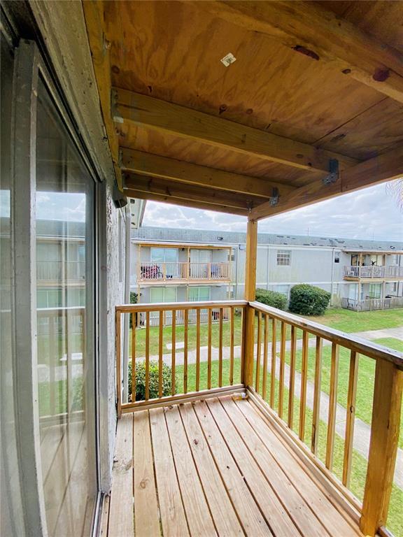 2757 L B McLeod Road, Unit C Orlando, FL 32805 - Photo 21 of 23 a view of balcony with wooden floor