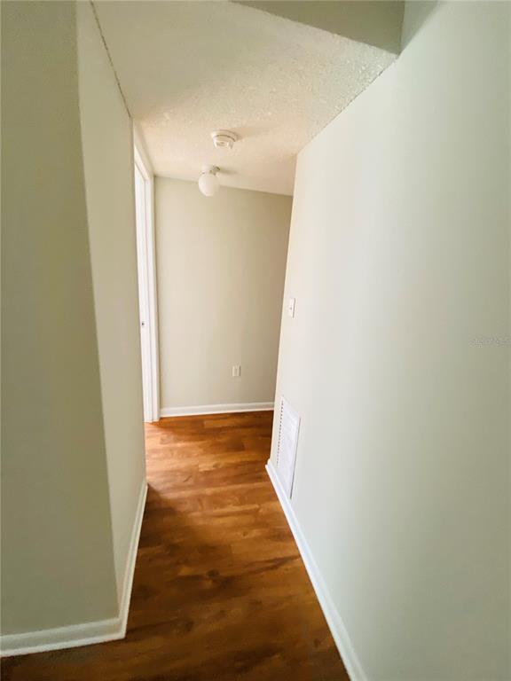 2757 L B McLeod Road, Unit C Orlando, FL 32805 - Photo 7 of 23 a view of a hallway with wooden floor