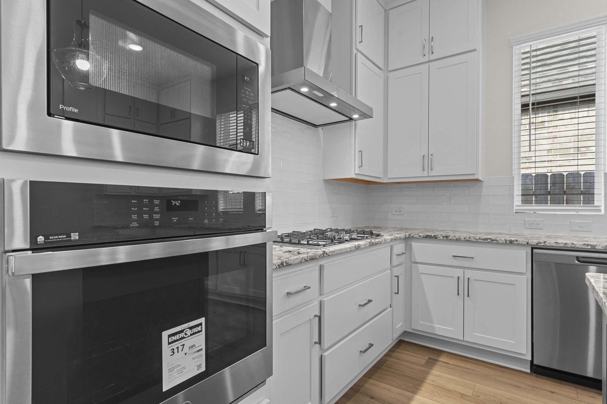 603 Debbie Court Rosharon, TX 77583 - Photo 11 of 26 a kitchen with stainless steel appliances granite countertop a stove and a microwave