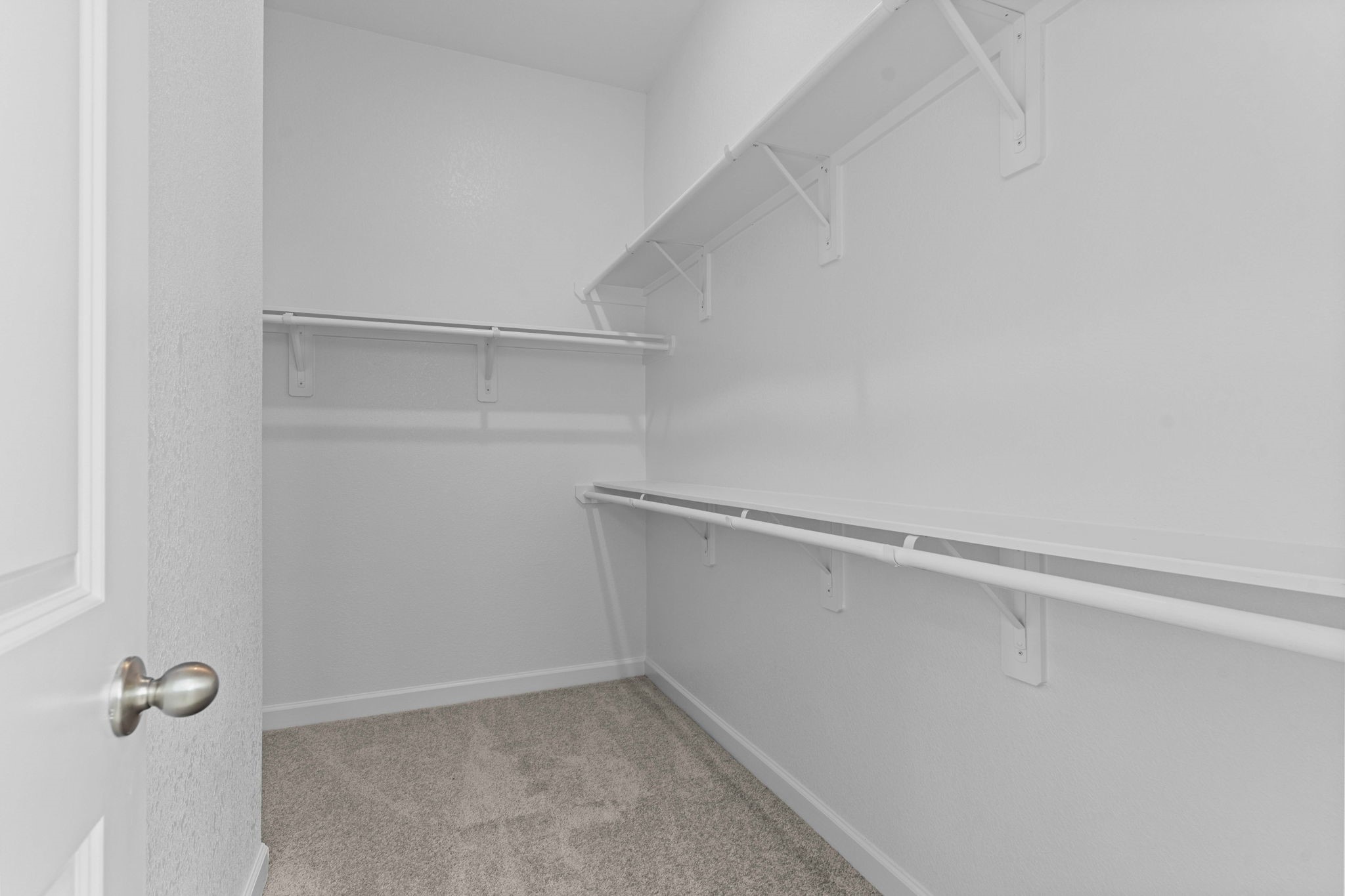 603 Debbie Court Rosharon, TX 77583 - Photo 18 of 26 a view of walk in closet with empty racks