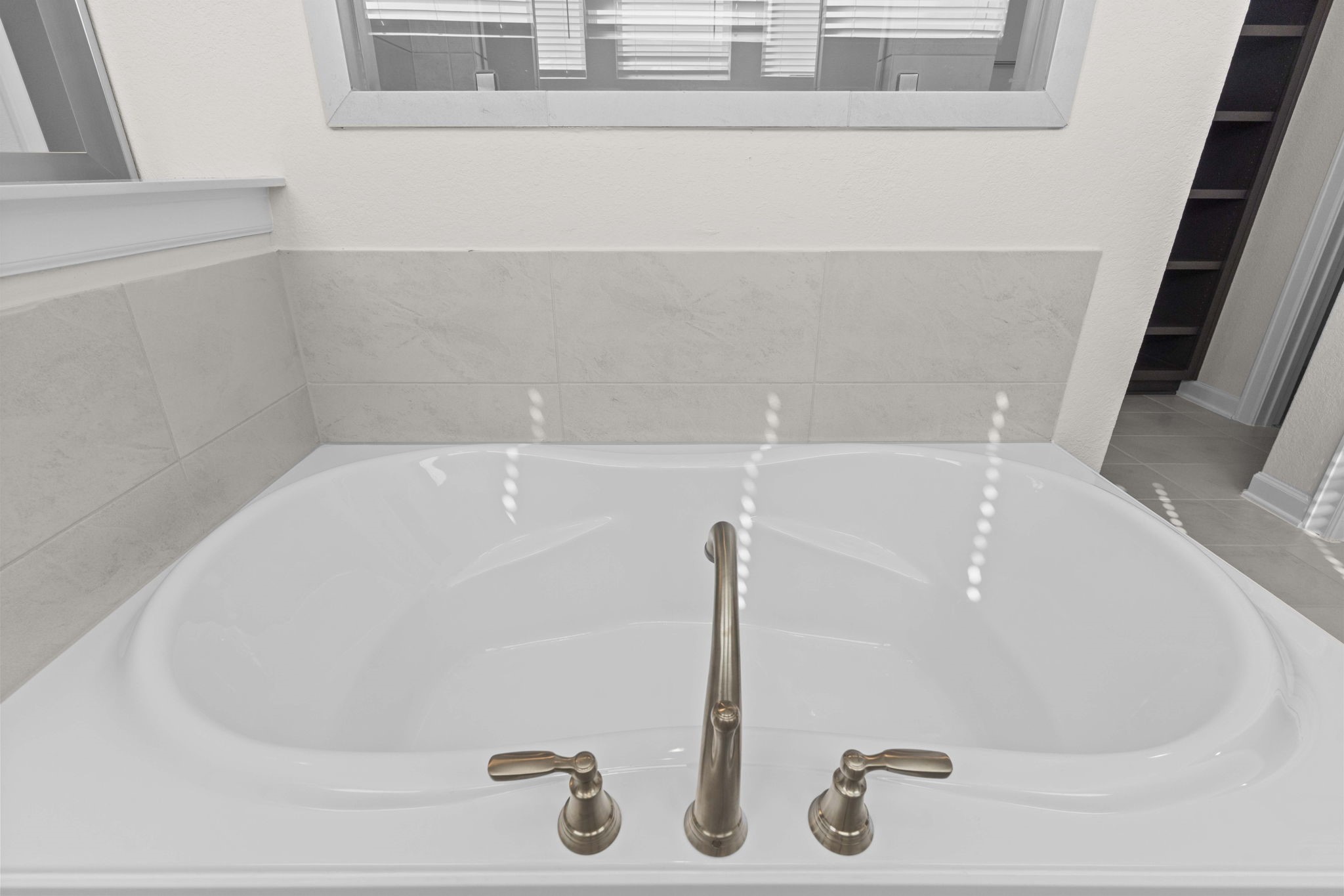 603 Debbie Court Rosharon, TX 77583 - Photo 20 of 26 a bath tub sitting next to a white sink