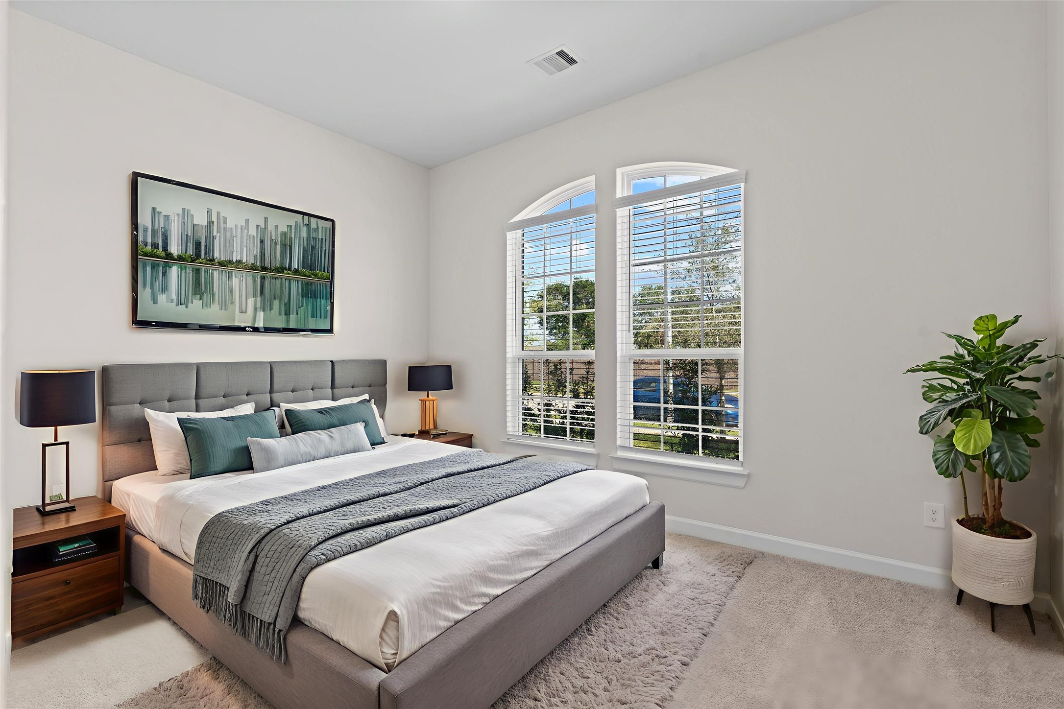 603 Debbie Court Rosharon, TX 77583 - Photo 2 of 26 a bedroom with bed and a potted plant