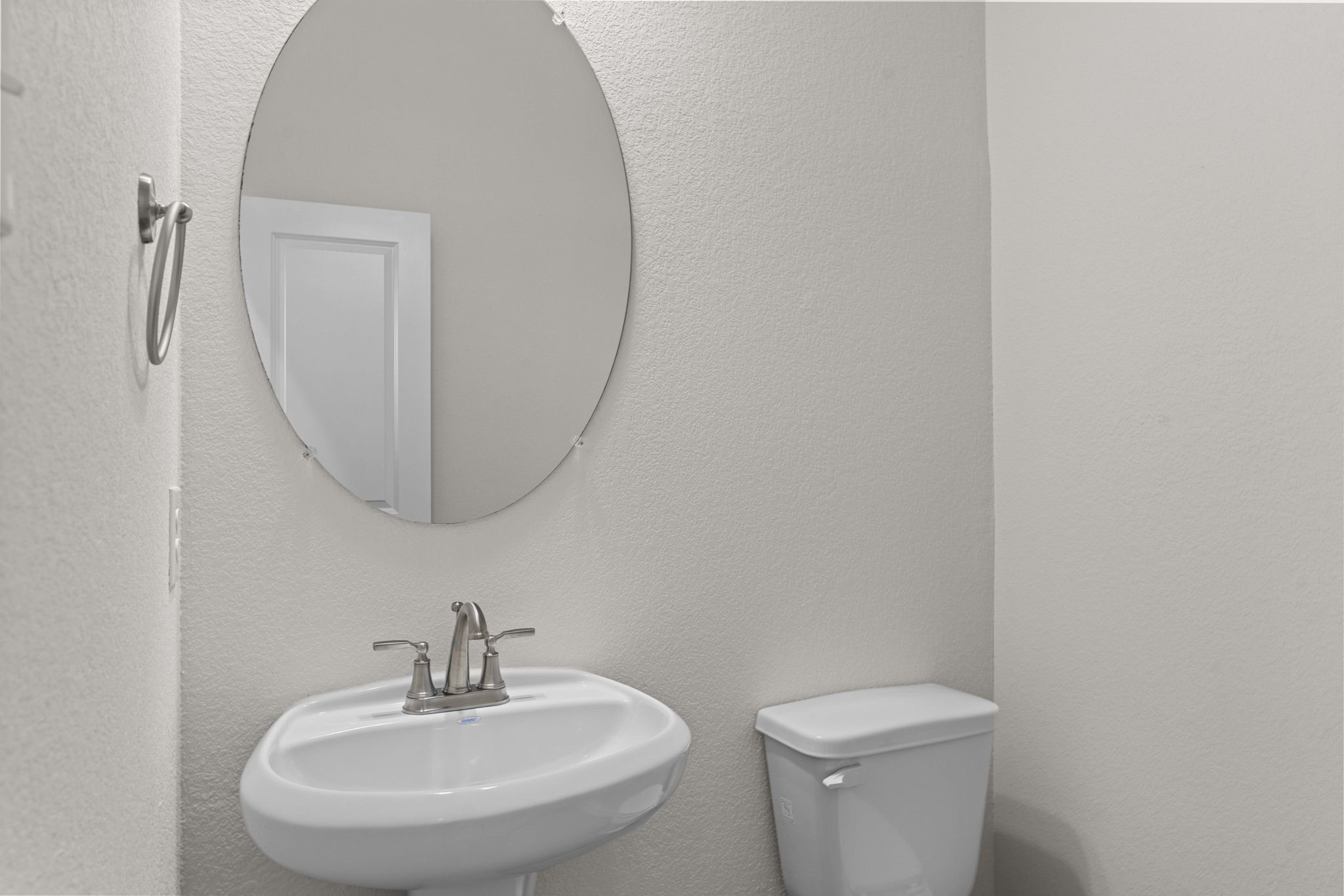 603 Debbie Court Rosharon, TX 77583 - Photo 6 of 26 a bathroom with a toilet a sink and mirror