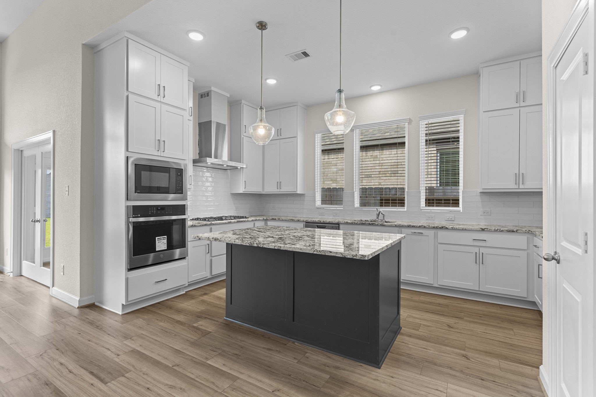 603 Debbie Court Rosharon, TX 77583 - Photo 8 of 26 a kitchen with stainless steel appliances granite countertop a stove a sink and a refrigerator