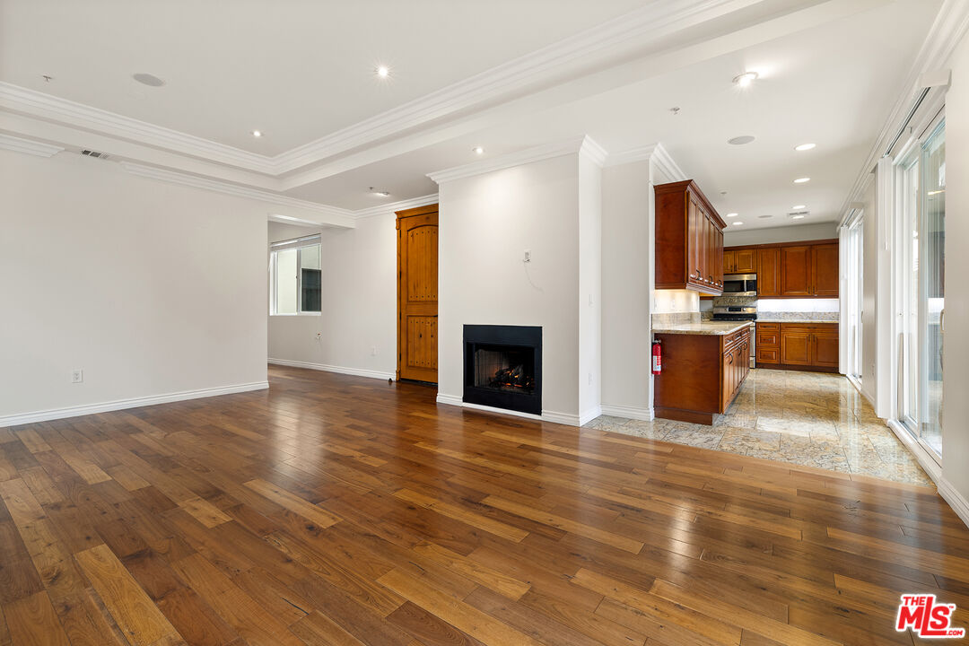 632 North Kings Road, Unit 201 West Hollywood, CA 90048 - Photo 2 of 14 a view of a kitchen with a sink and a fireplace