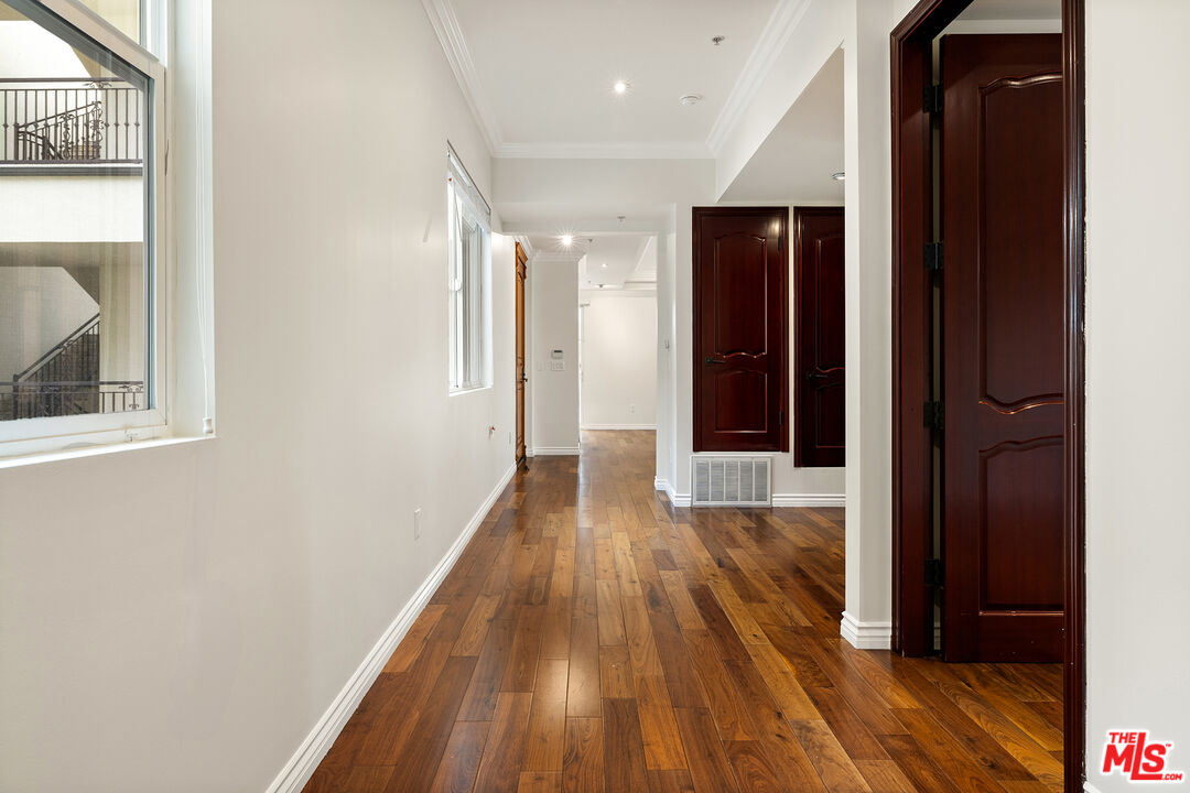 632 North Kings Road, Unit 201 West Hollywood, CA 90048 - Photo 4 of 14 a view of hallway with wooden floor