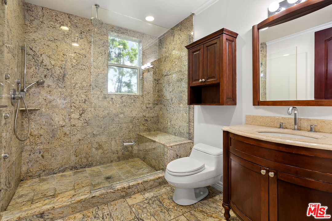 632 North Kings Road, Unit 201 West Hollywood, CA 90048 - Photo 6 of 14 a bathroom with a sink a toilet and shower
