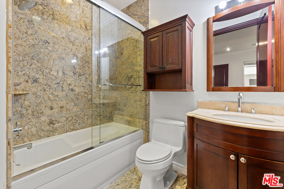 632 North Kings Road, Unit 201 West Hollywood, CA 90048 - Photo 8 of 14 a bathroom with a sink a toilet and shower