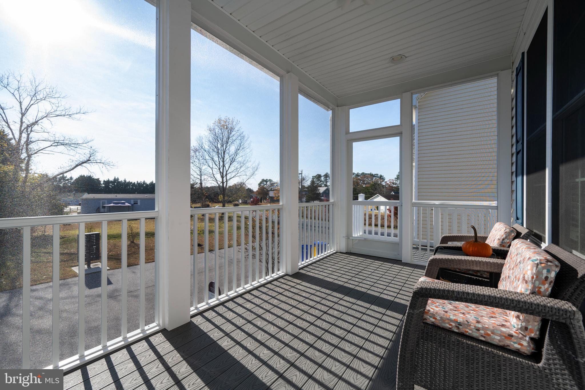 31311 Point Reyes Lane, Unit 15 Ocean View, DE 19970 - Photo 29 of 32 a balcony with furniture