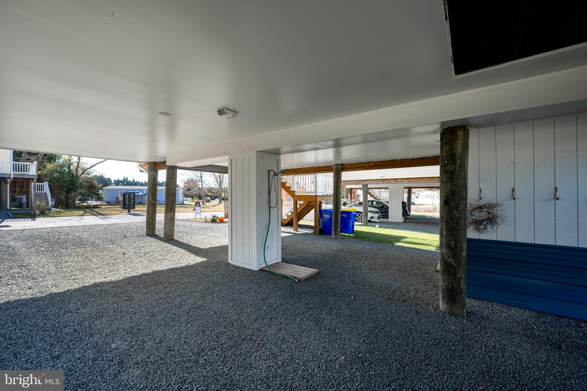 31311 Point Reyes Lane, Unit 15 Ocean View, DE 19970 - Photo 30 of 32 a living room with couch and a large window