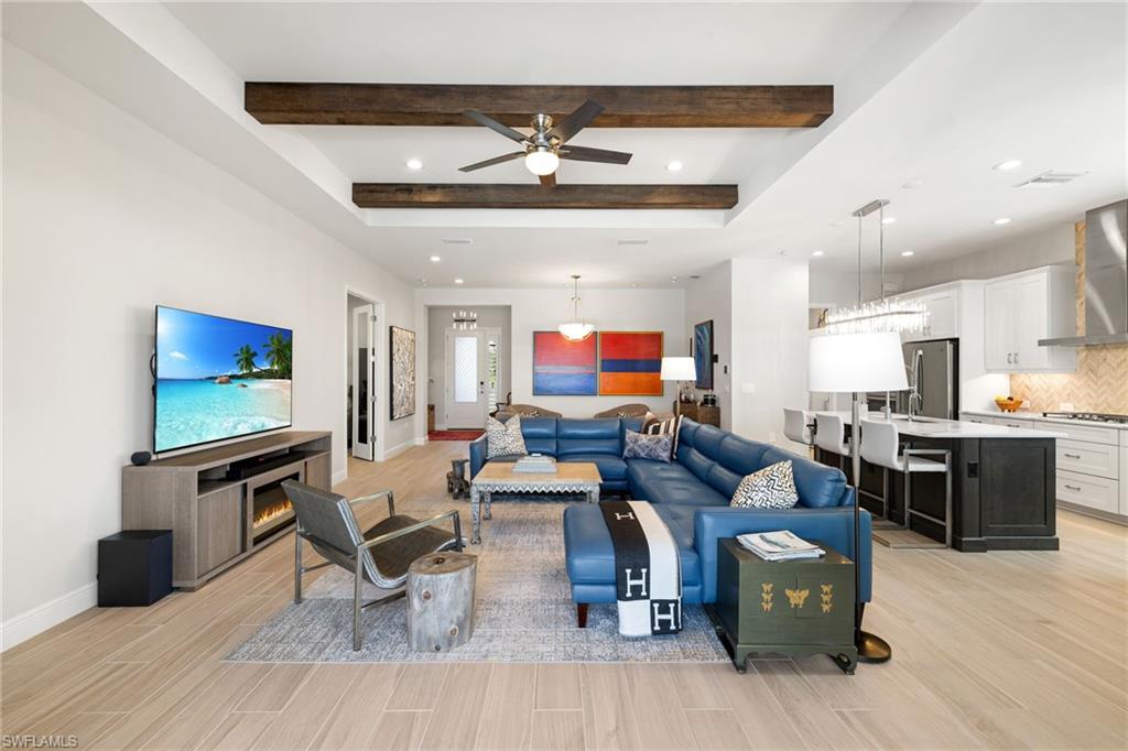 3967 Pegasus Way Naples, FL 34120 - Photo 5 of 50 a living room with furniture kitchen view and a wooden floor