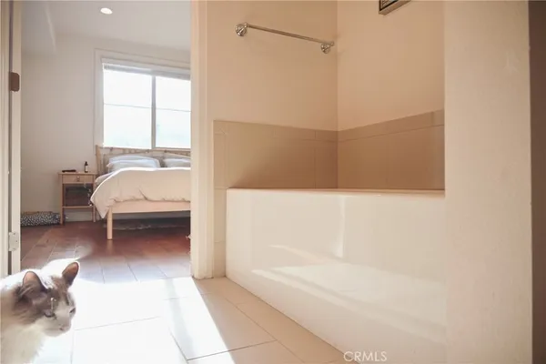 a en suite bathroom with a bathtub and a shower
