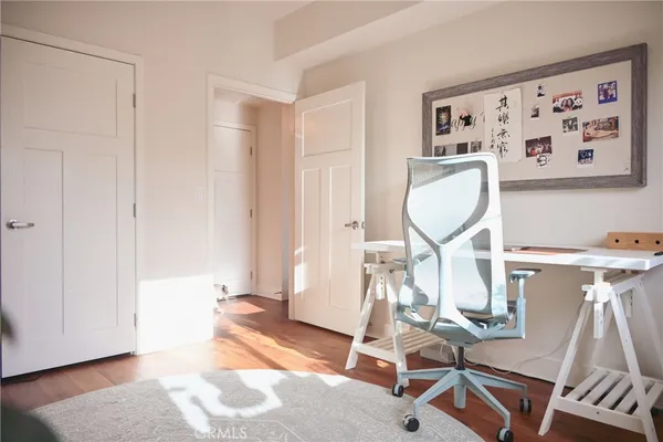 a view of a livingroom with furniture and a window