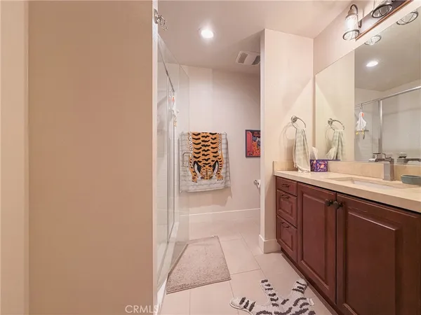 a bathroom with a double vanity sink and mirror
