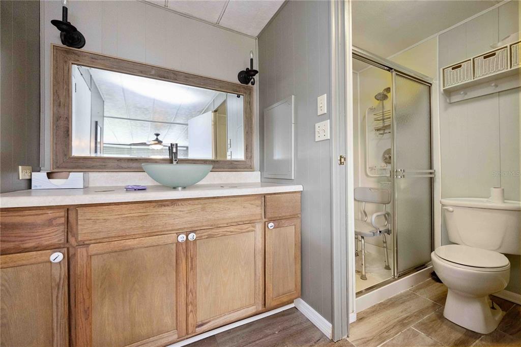 10303 Burnt Store Road, Unit 131 Punta Gorda, FL 33950 - Photo 14 of 25 a bathroom with a sink toilet and shower