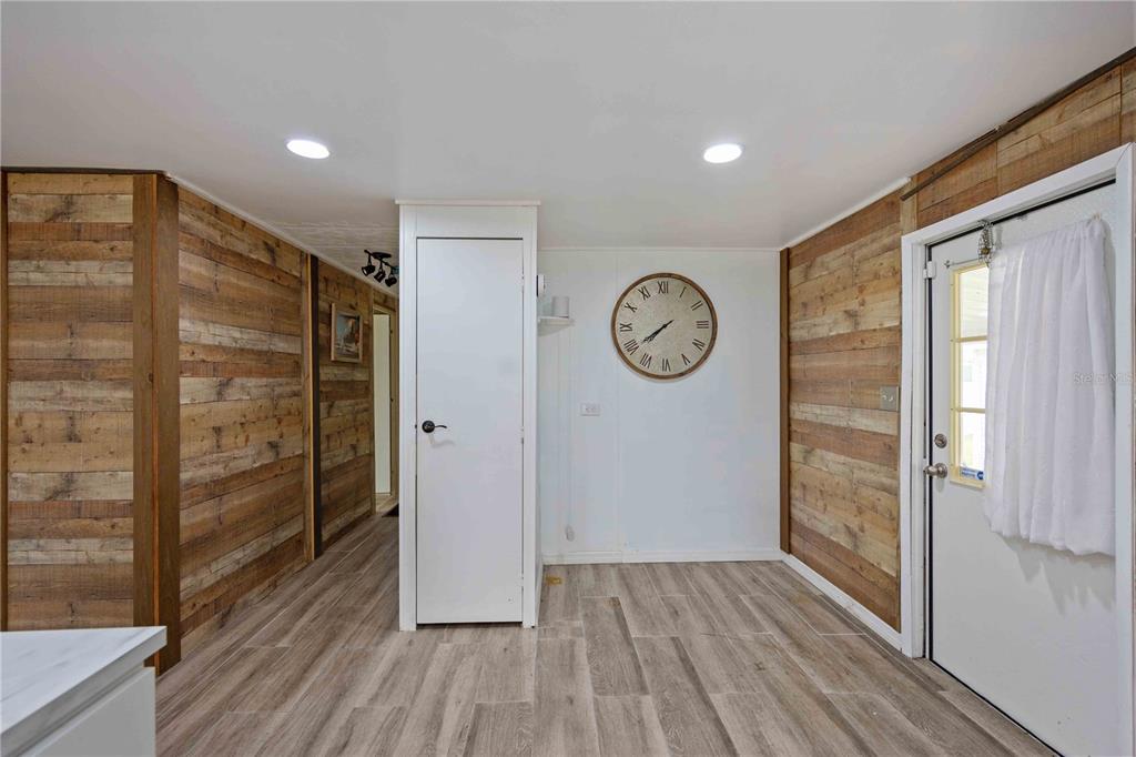 10303 Burnt Store Road, Unit 131 Punta Gorda, FL 33950 - Photo 7 of 25 a view of a hallway with wooden floor