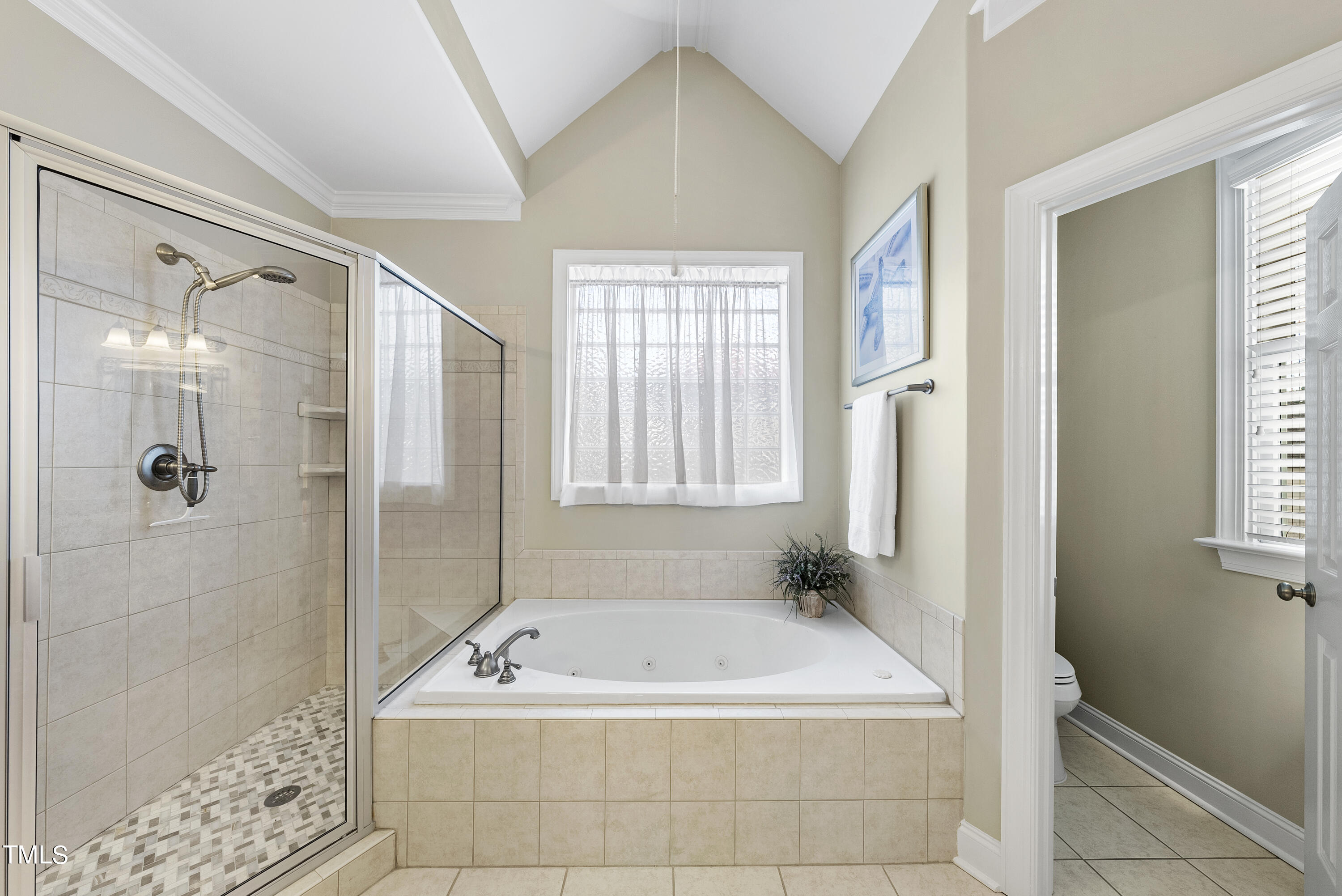 12740 Rosalie Street Raleigh, NC 27614 - Photo 27 of 43 a bath tub sitting in a bathroom next to a window