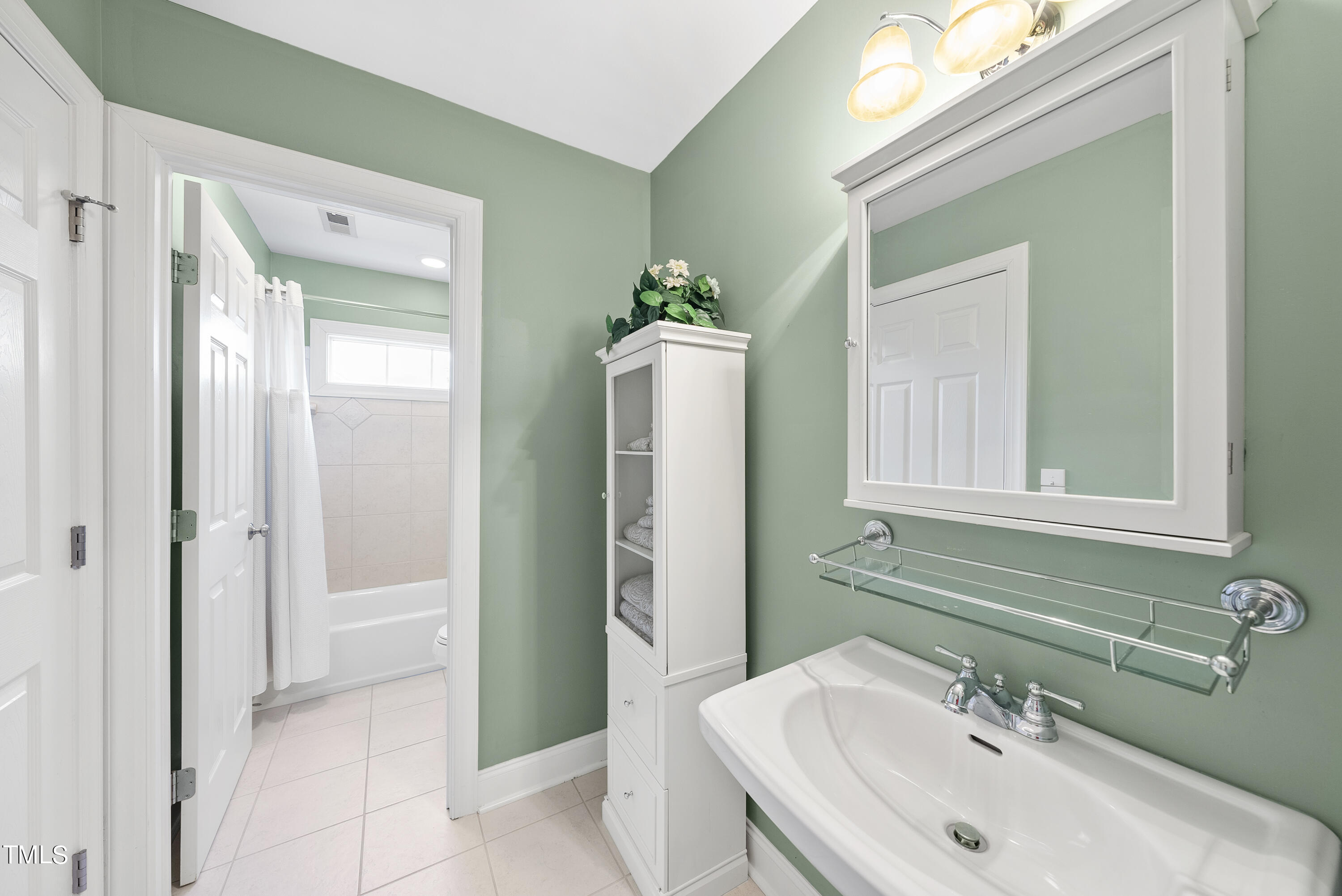 12740 Rosalie Street Raleigh, NC 27614 - Photo 34 of 43 a bathroom with a sink and a mirror