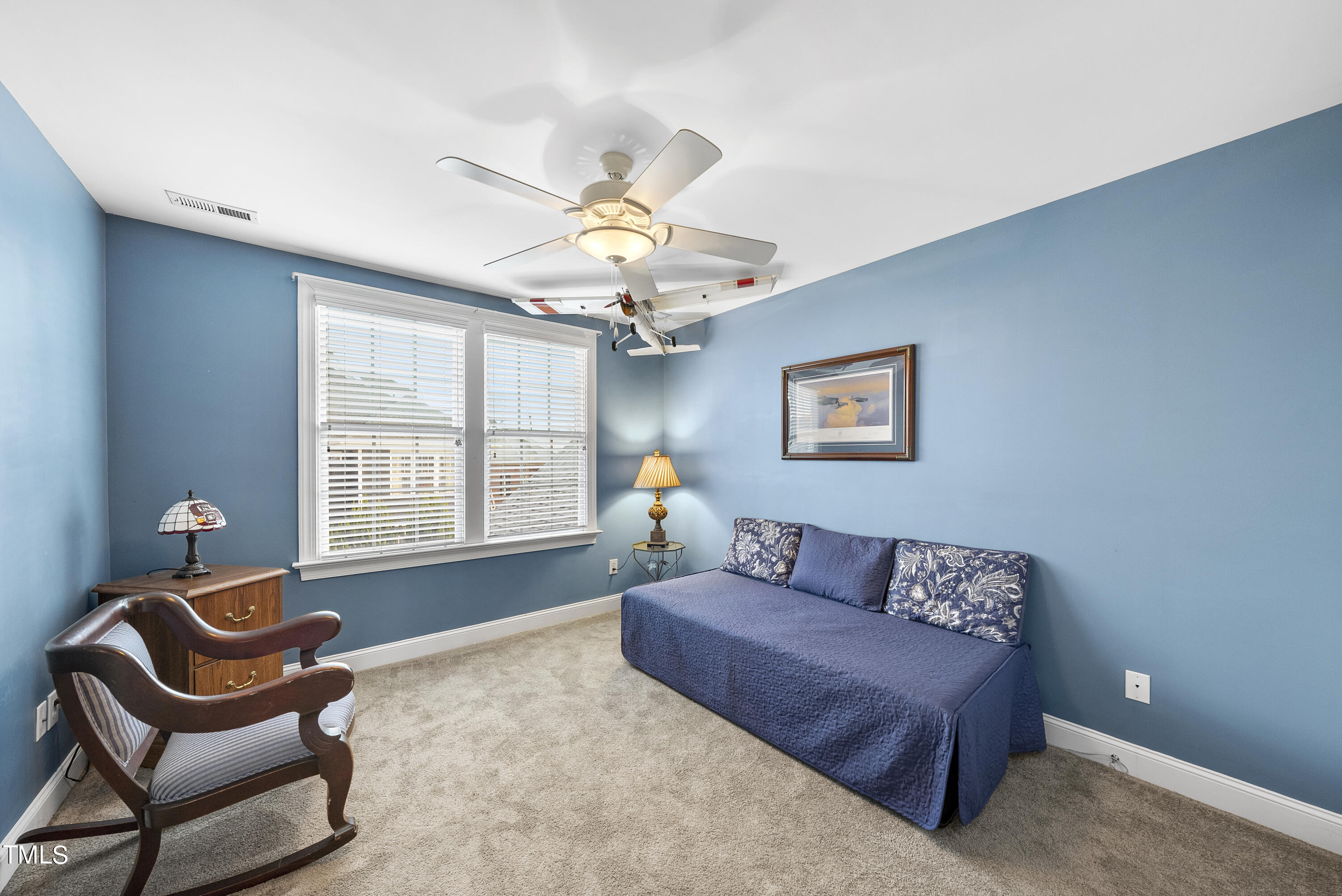 12740 Rosalie Street Raleigh, NC 27614 - Photo 39 of 43 a living room with furniture and a window