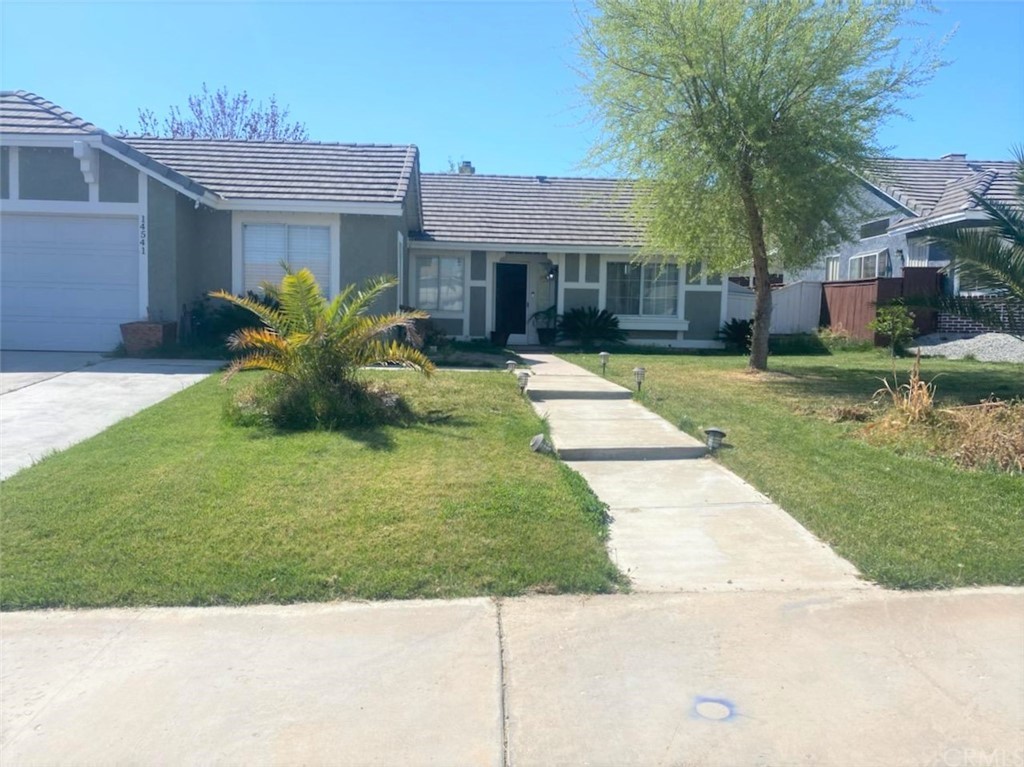 14541 Ponderosa Ranch Road Victorville, CA 92392 - Photo 1 of 1 a front view of a house with a yard