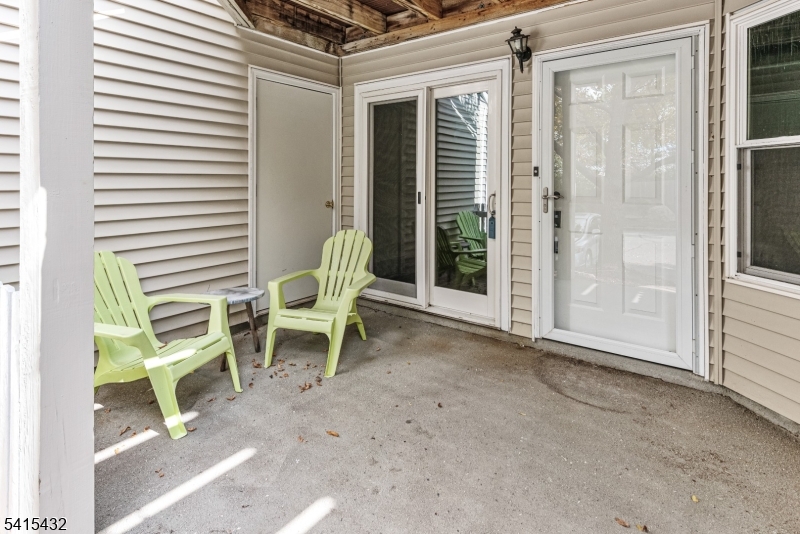 83 Mayfield Road, Unit 83 Bedminster, NJ 07921 - Photo 9 of 9 a chair and table in a balcony