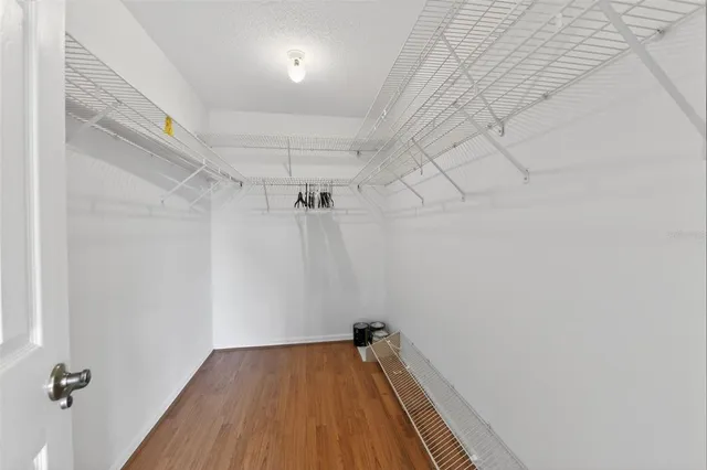 a bathroom with a sink a mirror a toilet and a window