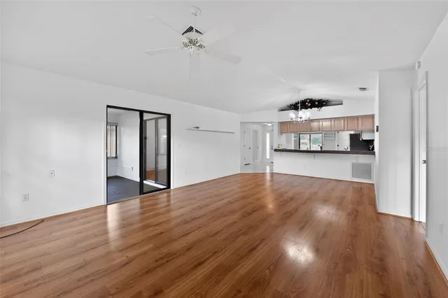 a view of a kitchen and a stove top oven