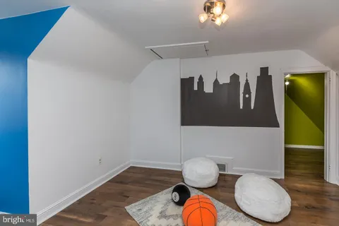 a bathroom with a wooden floor
