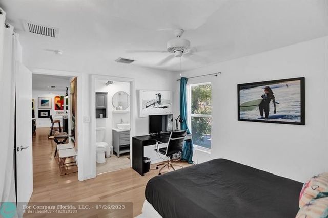a bedroom with furniture and a chandelier