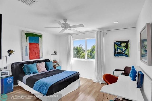 a bedroom with bed and a window