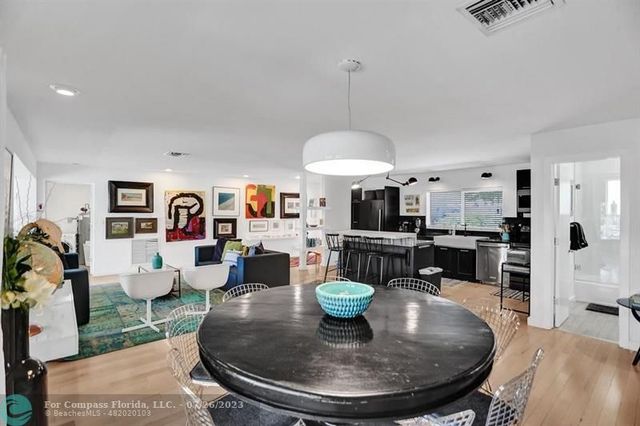 a living room with furniture a fireplace and a table