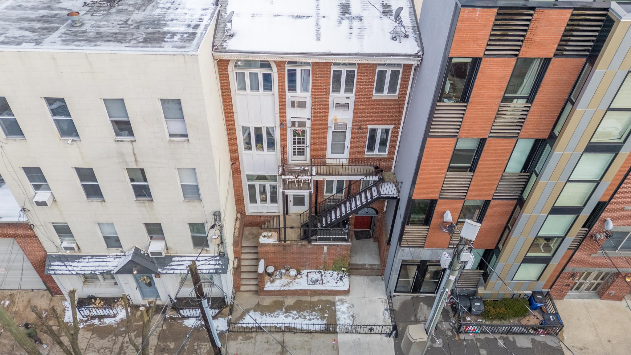 117 Clinton Street, Unit 1F Hoboken, NJ 07030 - Photo 20 of 24 a view of a building with many windows