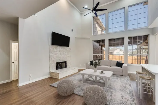 a living room with furniture fireplace and flat screen tv