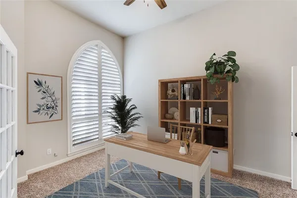 a dining room with furniture and floor to ceiling window