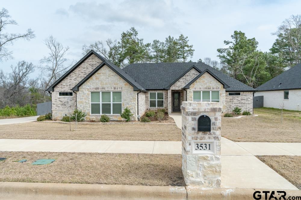 a view of a house with a yard