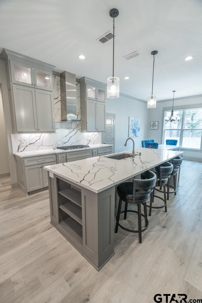 3531 Chapel View Tyler, TX 75707 - Photo 15 of 48 a kitchen with a stove a sink and chairs